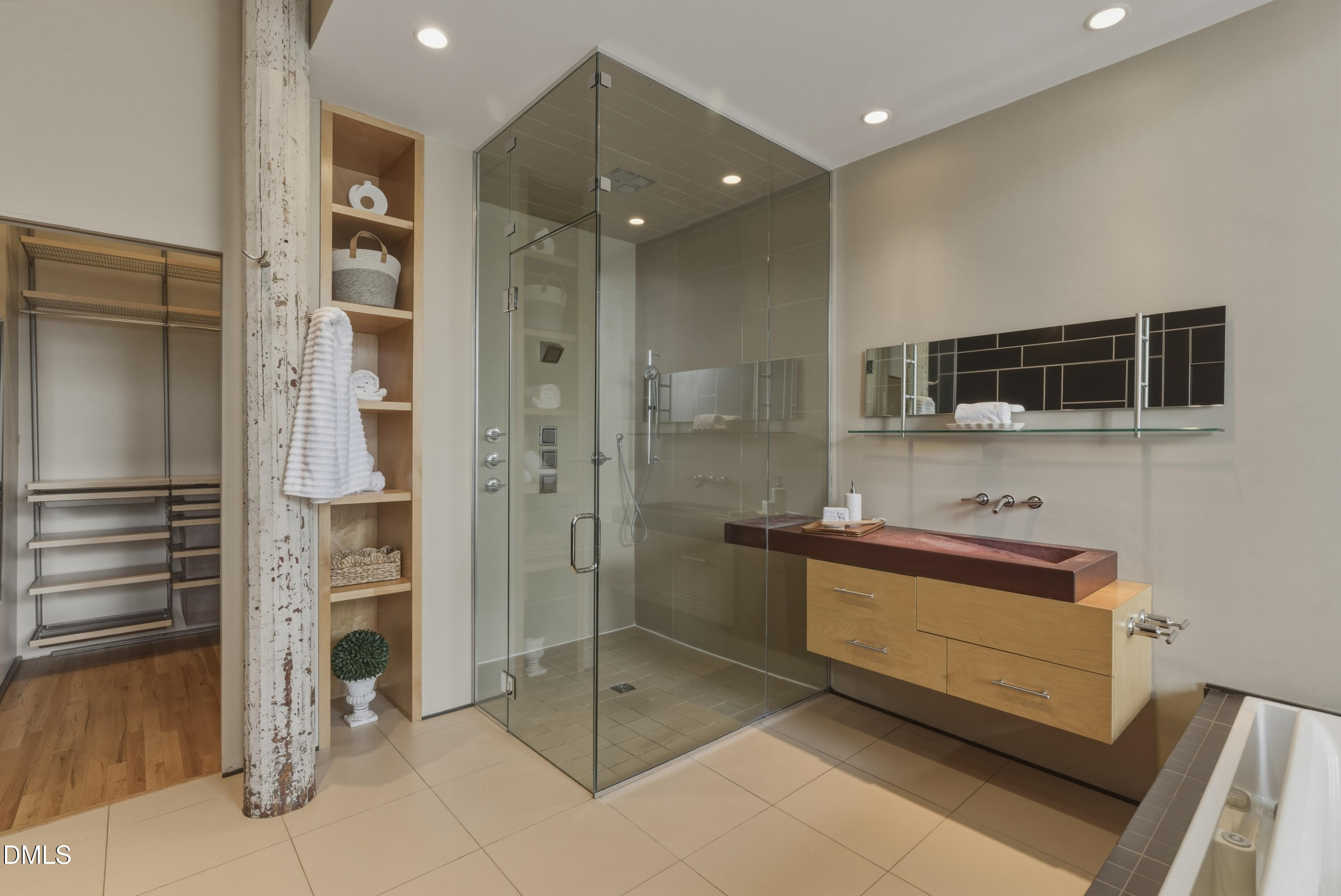 614 Capital Boulevard, Unit 114 Raleigh, NC 27603 - Photo 23 of 33 a bathroom with a shower and a sink