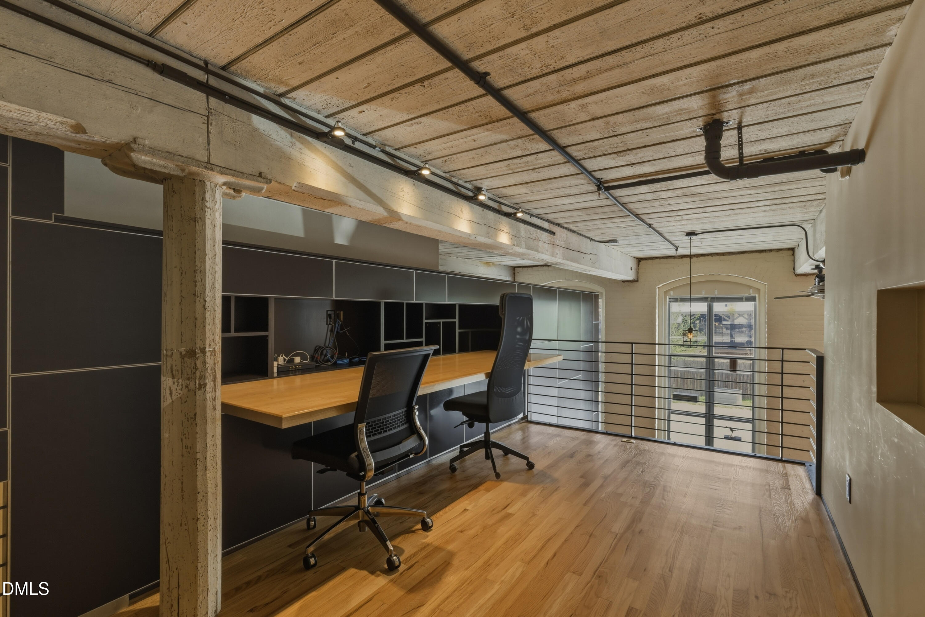 614 Capital Boulevard, Unit 114 Raleigh, NC 27603 - Photo 26 of 33 a view of a balcony with chair and wooden floor