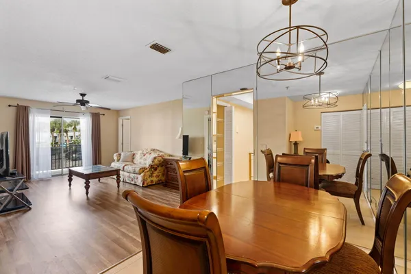a view of a dining room with furniture window and outside view