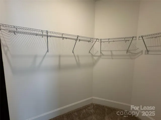 a bathroom with a sink a mirror and a toilet