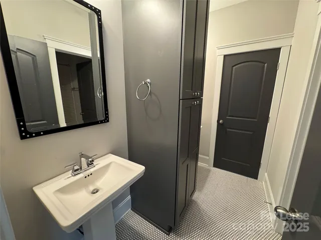 a bathroom with a bathtub and shower