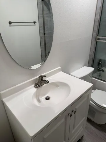 a bathroom with a sink and mirror