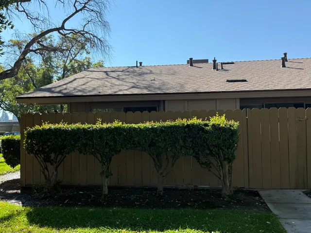 a view of a house with a yard and a tub