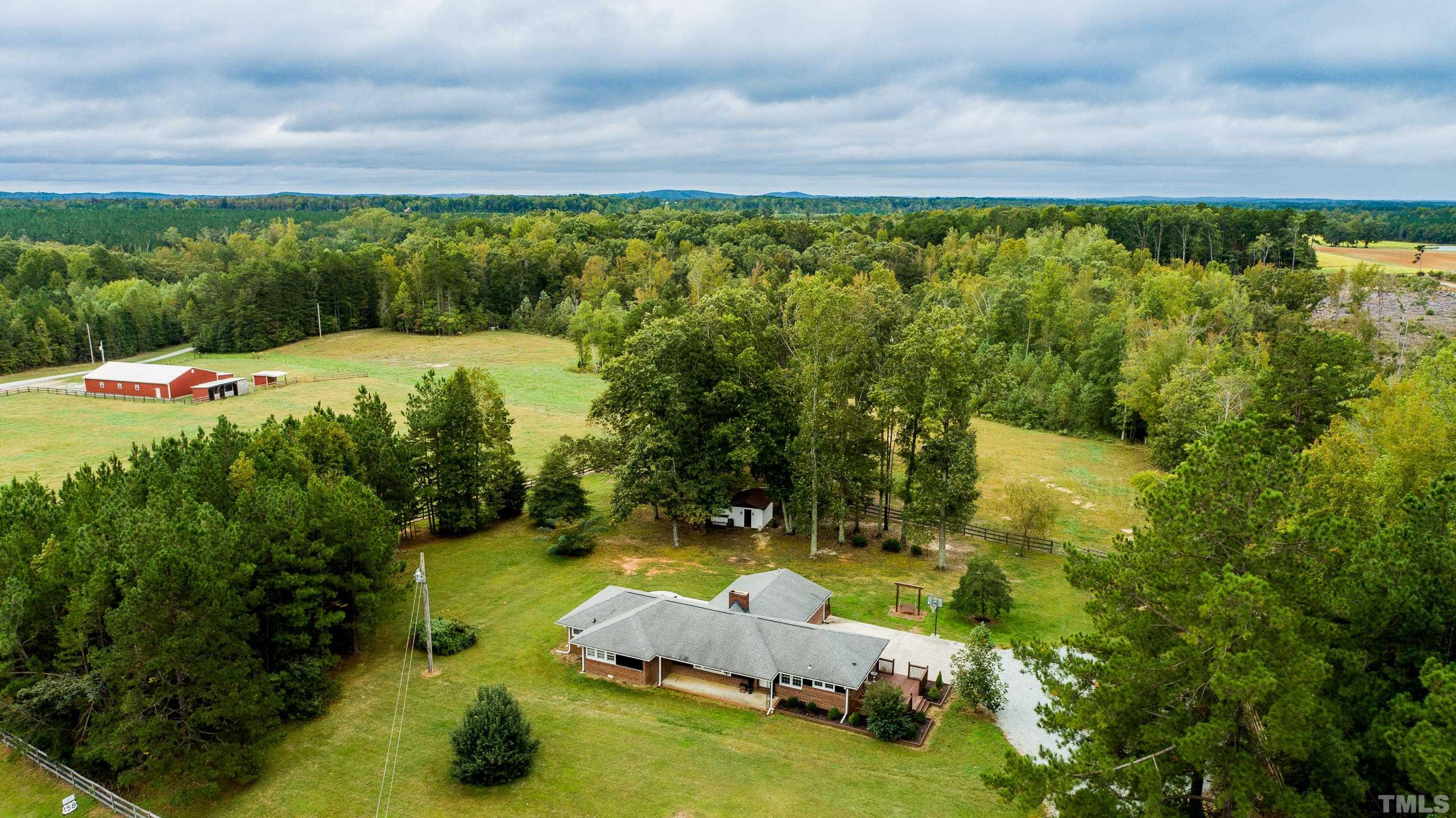 3920 Oxford Road Roxboro, NC 27574 - Photo 1 of 30 a view of a swimming pool and lounge chair