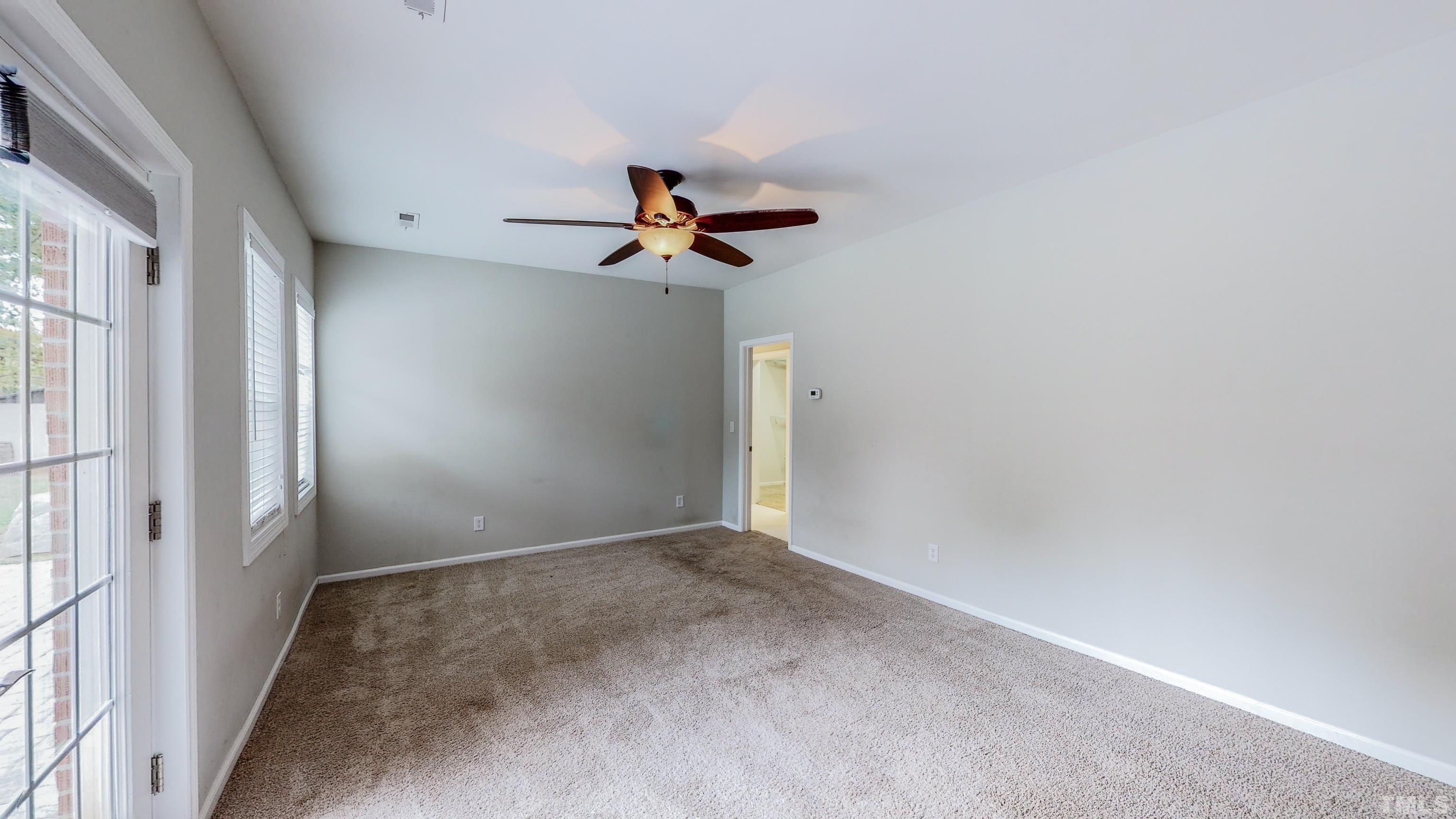 3920 Oxford Road Roxboro, NC 27574 - Photo 11 of 30 a view of room with a ceiling fan and window