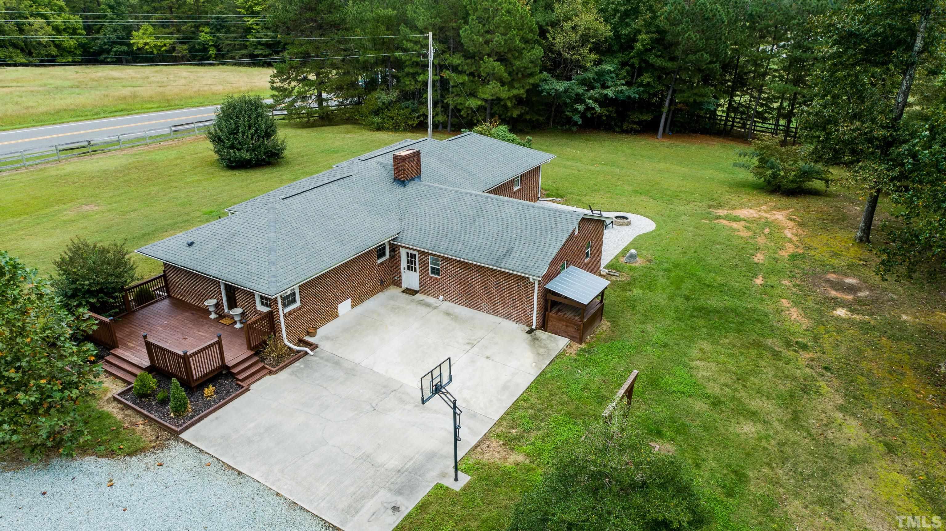 3920 Oxford Road Roxboro, NC 27574 - Photo 16 of 30 a view of a backyard with sitting area
