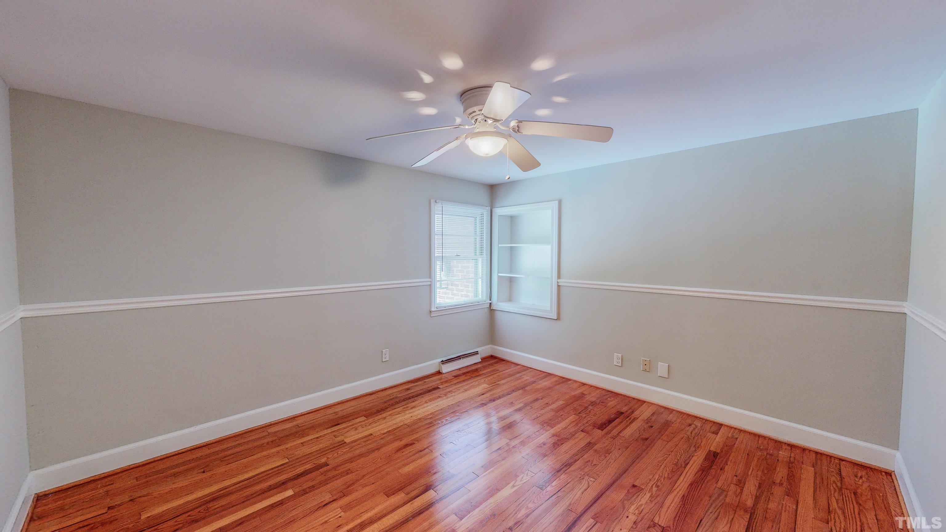 3920 Oxford Road Roxboro, NC 27574 - Photo 18 of 30 wooden floor in an empty room with a window