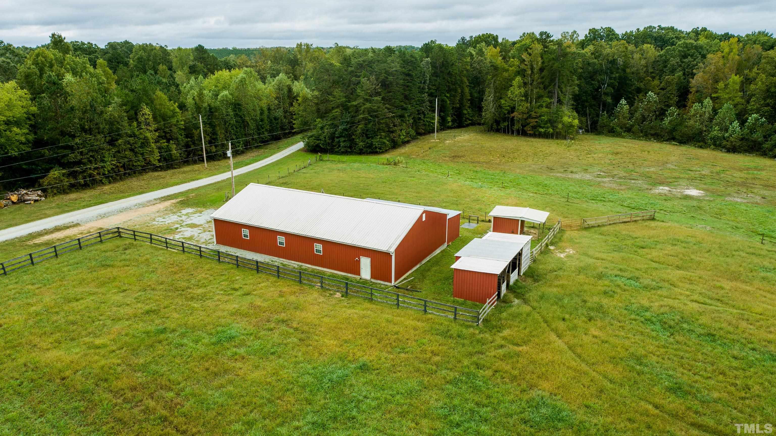 3920 Oxford Road Roxboro, NC 27574 - Photo 21 of 30 a view of a big yard with an outdoor seating