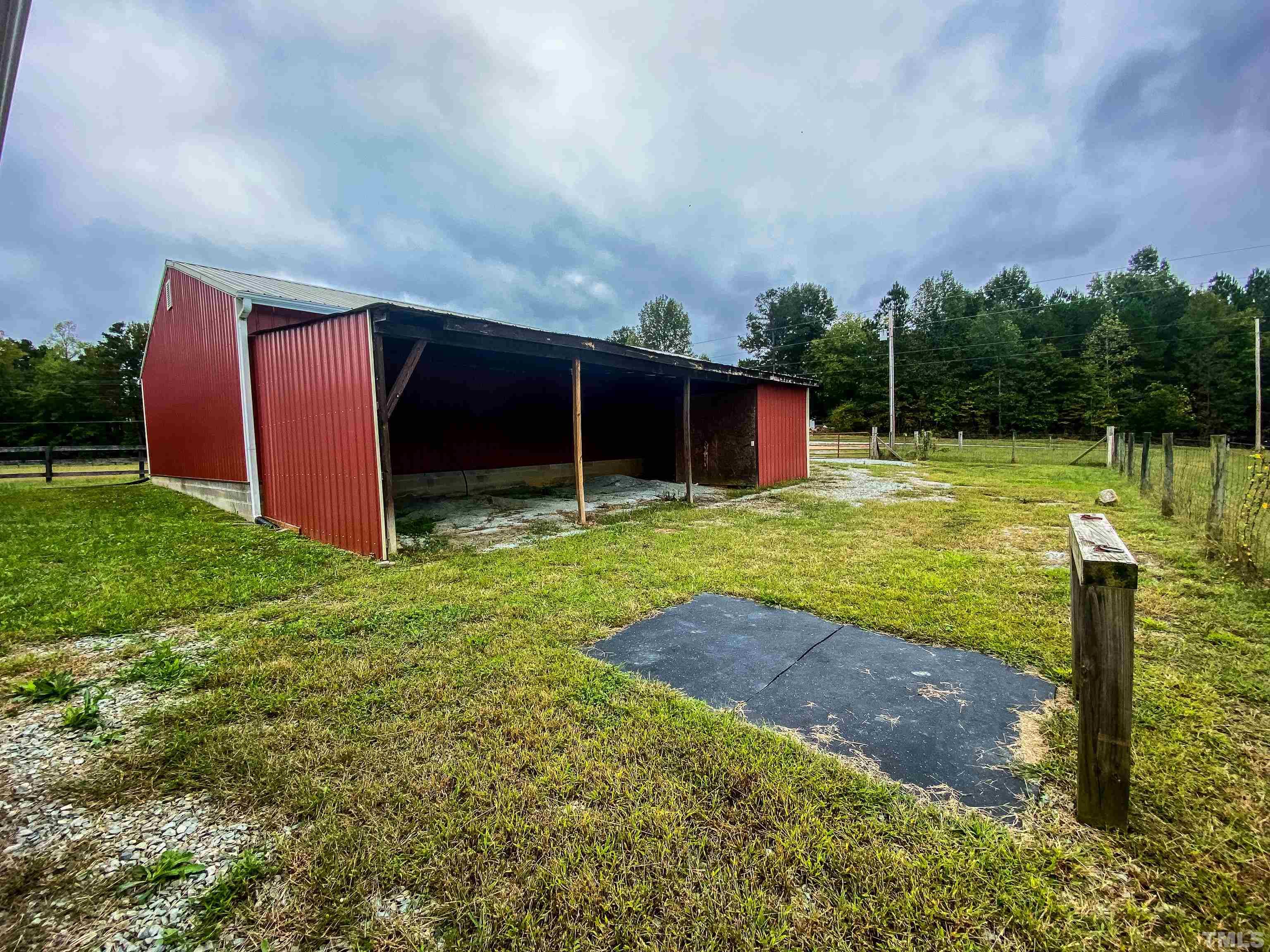 3920 Oxford Road Roxboro, NC 27574 - Photo 28 of 30 a view of a backyard