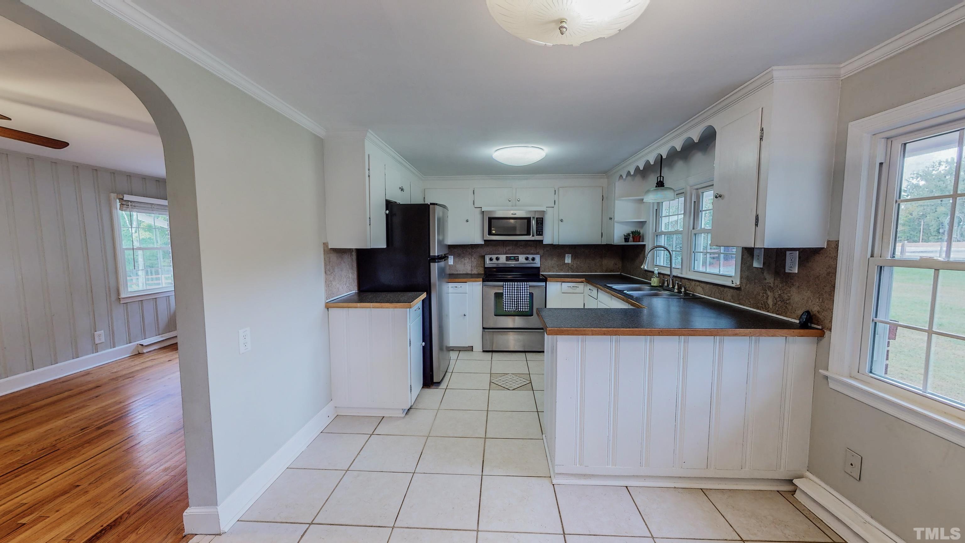 3920 Oxford Road Roxboro, NC 27574 - Photo 4 of 30 a kitchen with stainless steel appliances granite countertop a refrigerator sink and cabinets