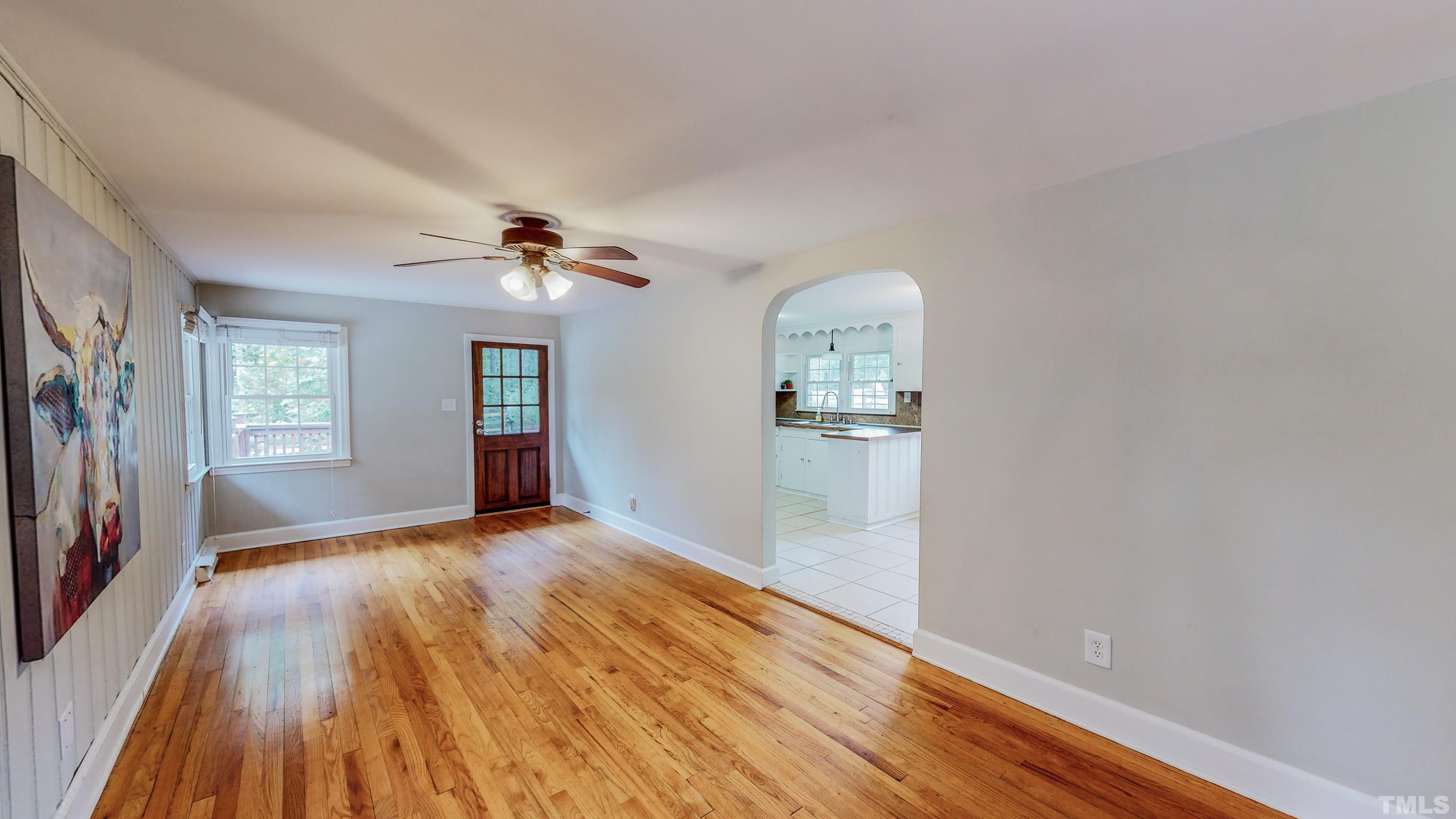 3920 Oxford Road Roxboro, NC 27574 - Photo 7 of 30 a view of livingroom with hardwood floor and a ceiling fan