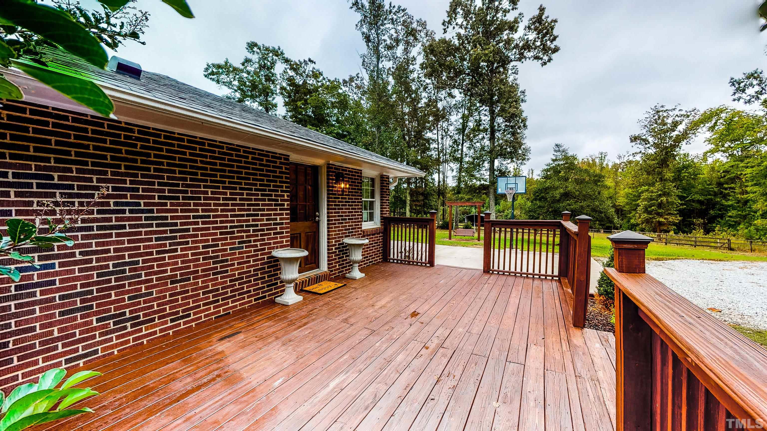 3920 Oxford Road Roxboro, NC 27574 - Photo 8 of 30 a view of a deck with wooden floor and barbeque oven