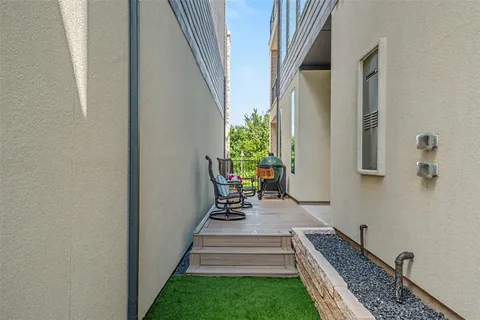 a view of balcony with furniture