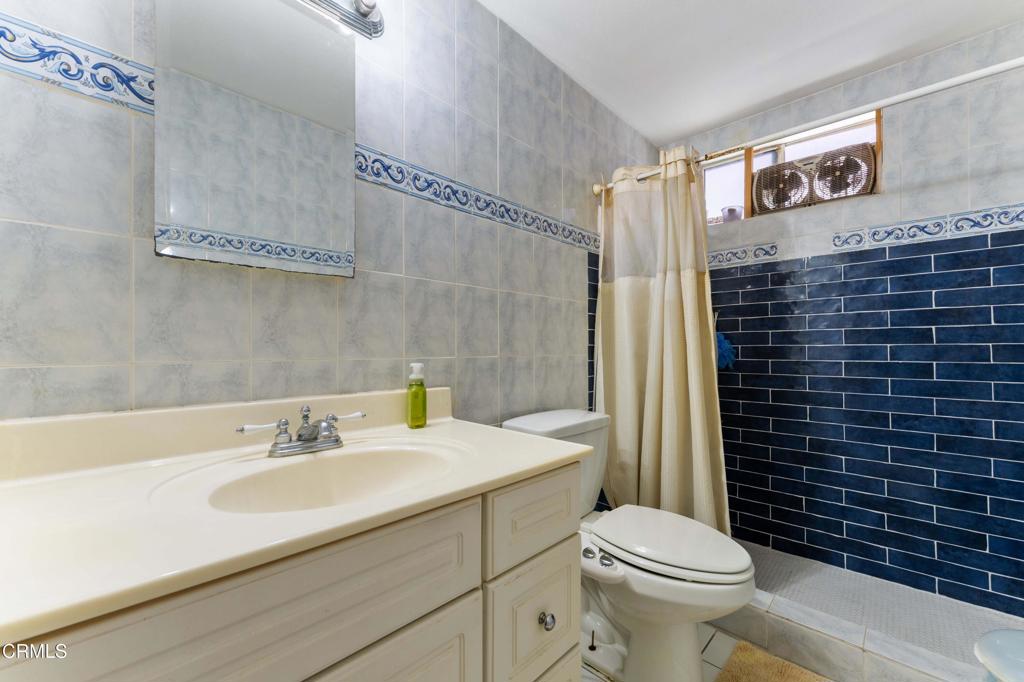 1421 East Abbottson Street Carson, CA 90746 - Photo 11 of 18 a bathroom with a sink toilet and shower