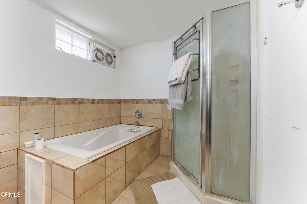 1421 East Abbottson Street Carson, CA 90746 - Photo 12 of 18 a bathroom with a sink and a shower