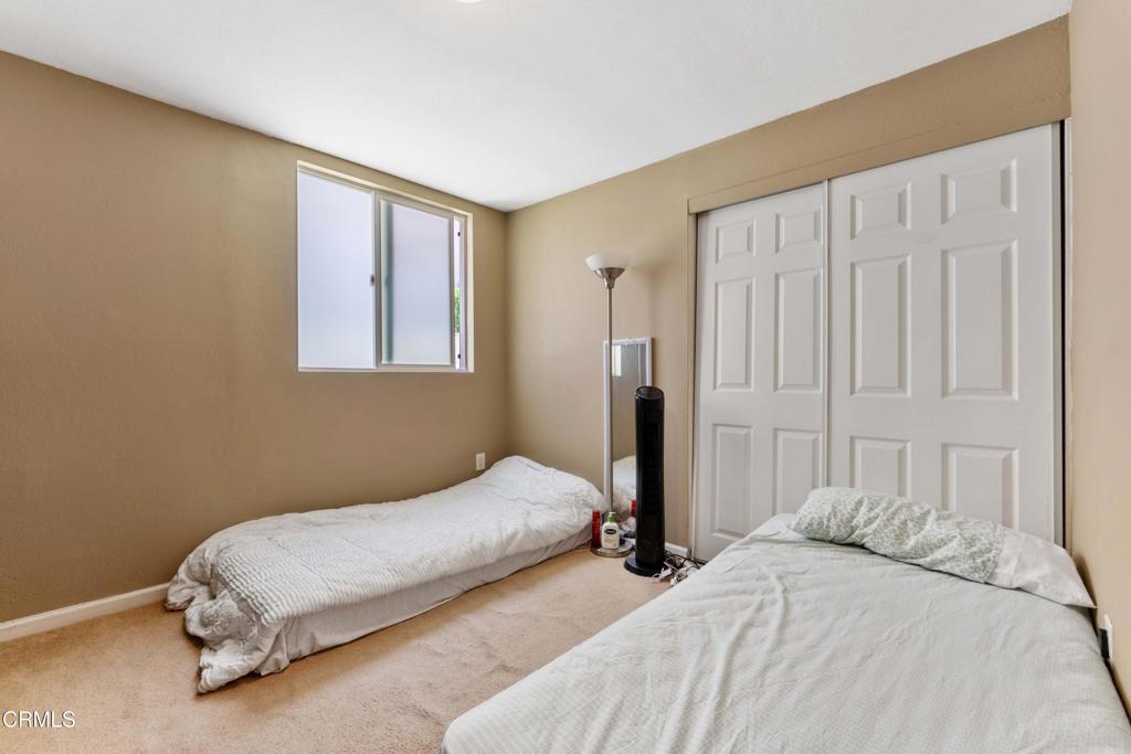 1421 East Abbottson Street Carson, CA 90746 - Photo 14 of 18 a bedroom with a bed and a window