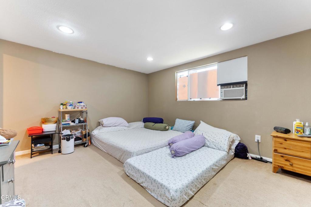 1421 East Abbottson Street Carson, CA 90746 - Photo 15 of 18 a bedroom with a bed and a tv