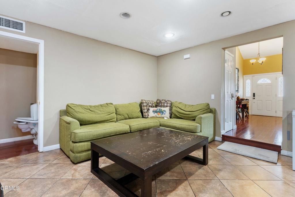 1421 East Abbottson Street Carson, CA 90746 - Photo 8 of 18 a living room with furniture and a table