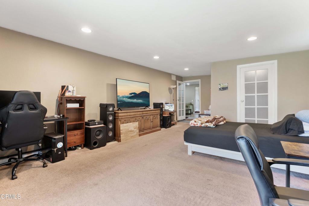 1421 East Abbottson Street Carson, CA 90746 - Photo 9 of 18 a living room with furniture and a flat screen tv