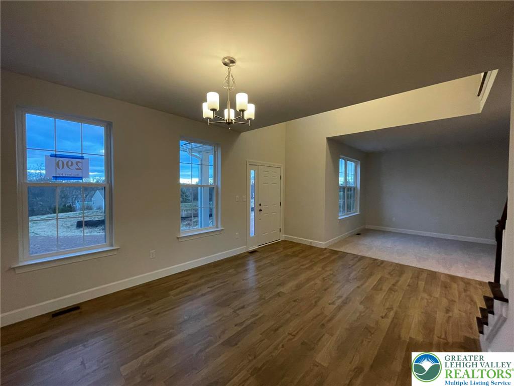 5043 Chapmans Road Orefield, PA 18069 - Photo 4 of 18 a view of an empty room with window and wooden floor