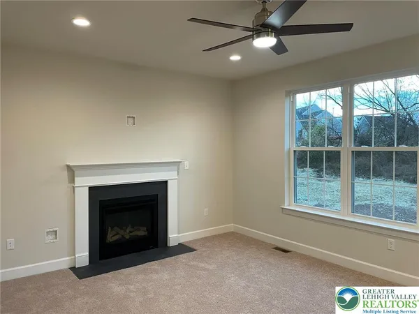 a kitchen with stainless steel appliances granite countertop a refrigerator a sink and a stove top oven