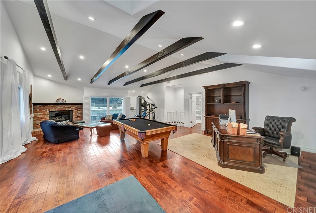 22963 Cass Avenue Woodland Hills, CA 91364 - Photo 13 of 66 800 sft bonus room with fireplace and sink