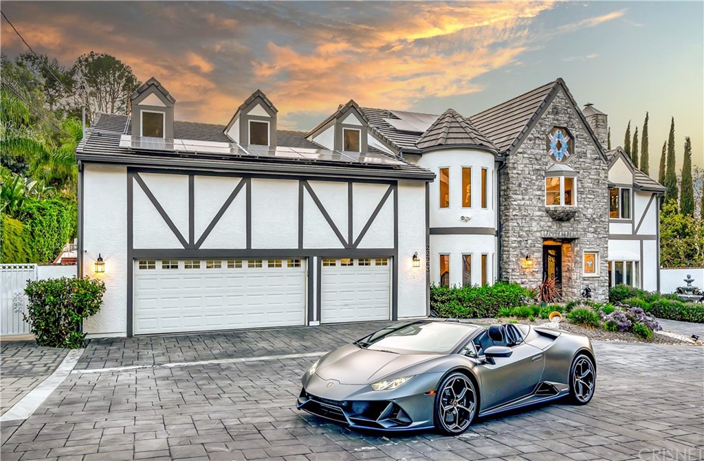 22963 Cass Avenue Woodland Hills, CA 91364 - Photo 24 of 66 Oversized 3-car finished garage with high ceilings and side access to RV parking