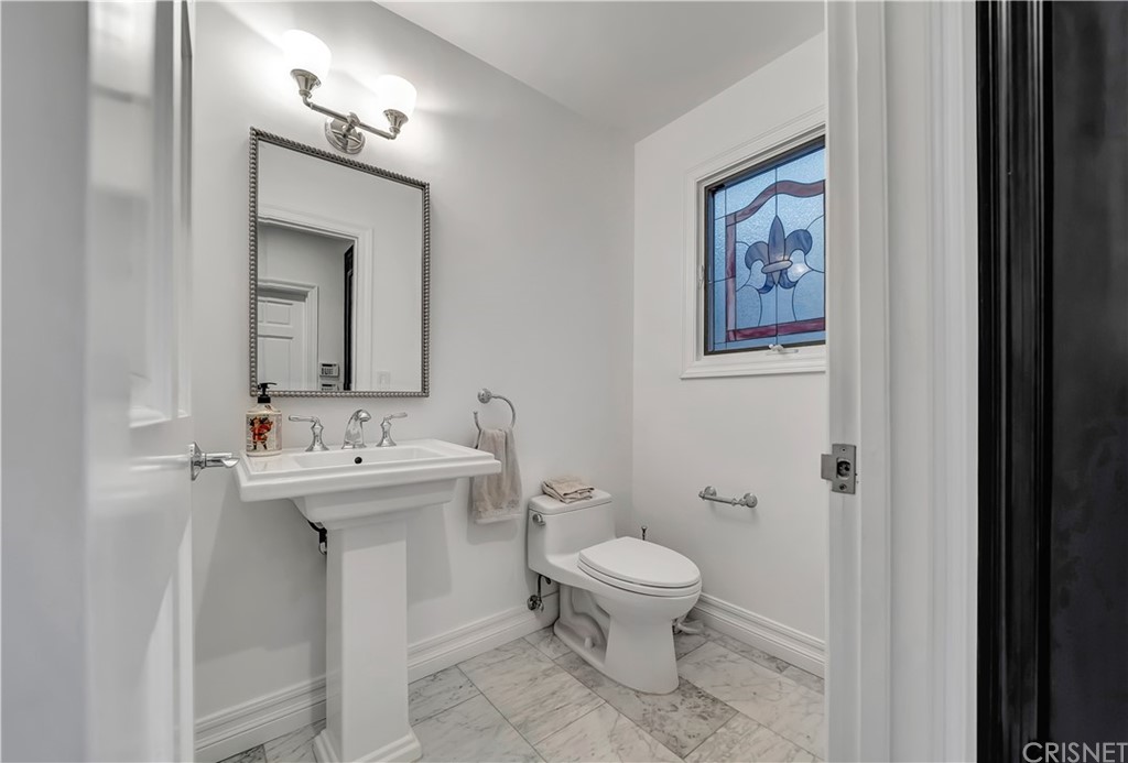 22963 Cass Avenue Woodland Hills, CA 91364 - Photo 28 of 66 Powder room off of living room near front door