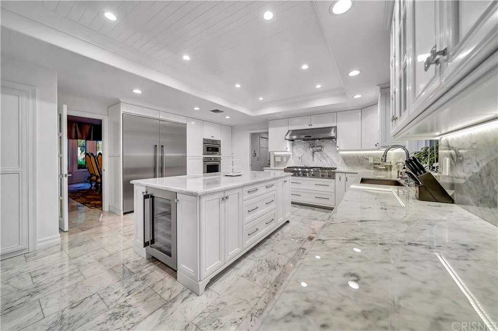 22963 Cass Avenue Woodland Hills, CA 91364 - Photo 35 of 66 White carrera marble counter tops with protective seal