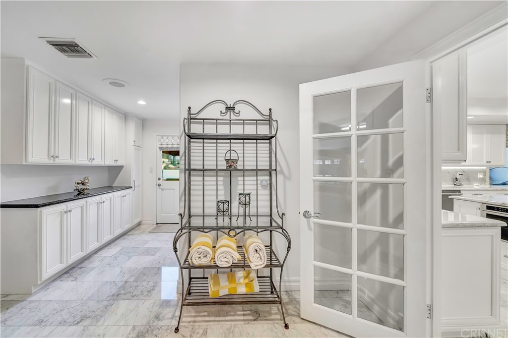 22963 Cass Avenue Woodland Hills, CA 91364 - Photo 38 of 66 Mud room access from garage and pool