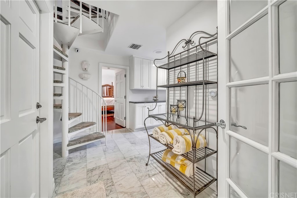 22963 Cass Avenue Woodland Hills, CA 91364 - Photo 40 of 66 a view of a livingroom with furniture and a window