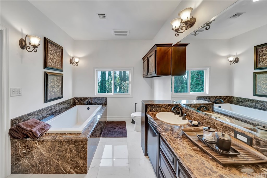 22963 Cass Avenue Woodland Hills, CA 91364 - Photo 47 of 66 Jack and Jill full bathroom with walk-in shower`*