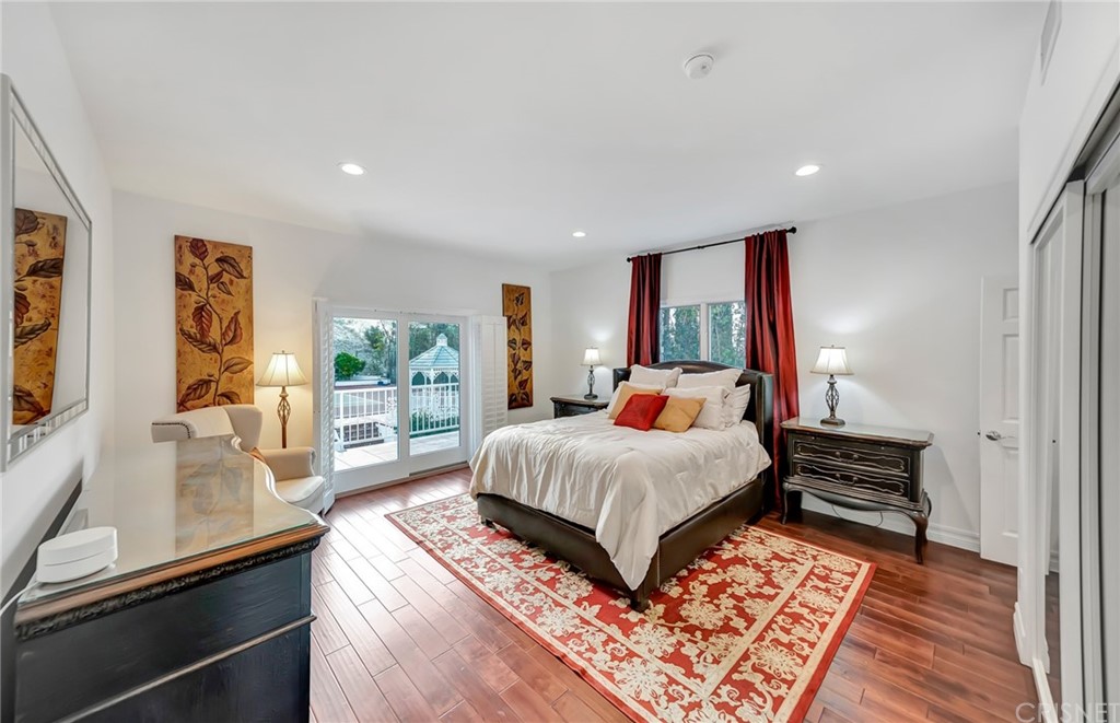 22963 Cass Avenue Woodland Hills, CA 91364 - Photo 50 of 66 a bed room with a bed and a large window