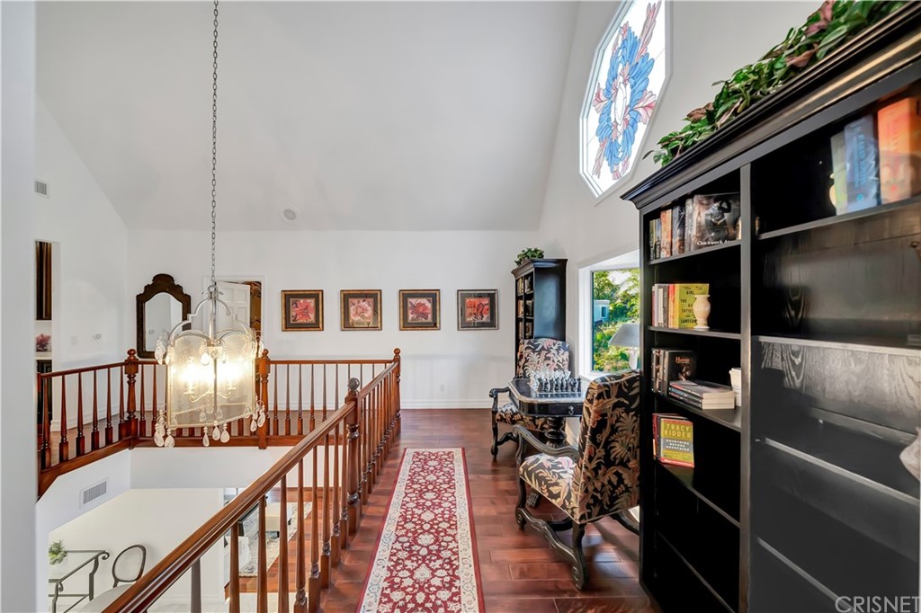 22963 Cass Avenue Woodland Hills, CA 91364 - Photo 57 of 66 Upstairs sitting area with stained glass window leading to master