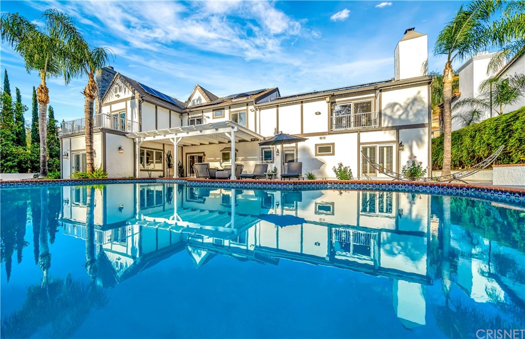 22963 Cass Avenue Woodland Hills, CA 91364 - Photo 58 of 66 Pool with in deck solar heating system and outdoor shower with filtered water