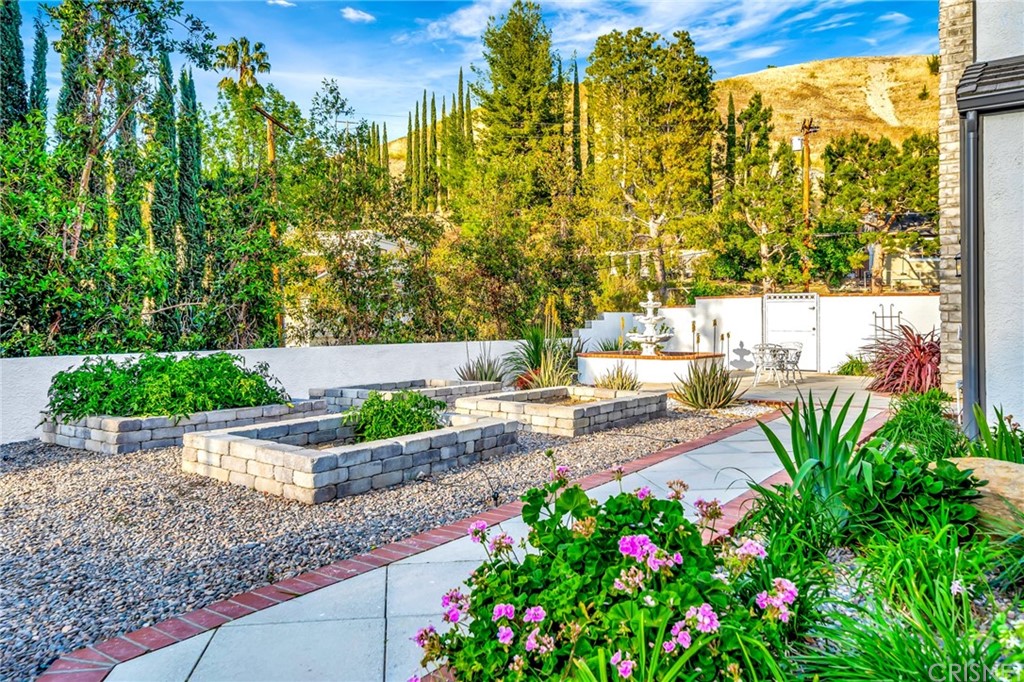 22963 Cass Avenue Woodland Hills, CA 91364 - Photo 63 of 66 Irrigated gardens and garden fountain.