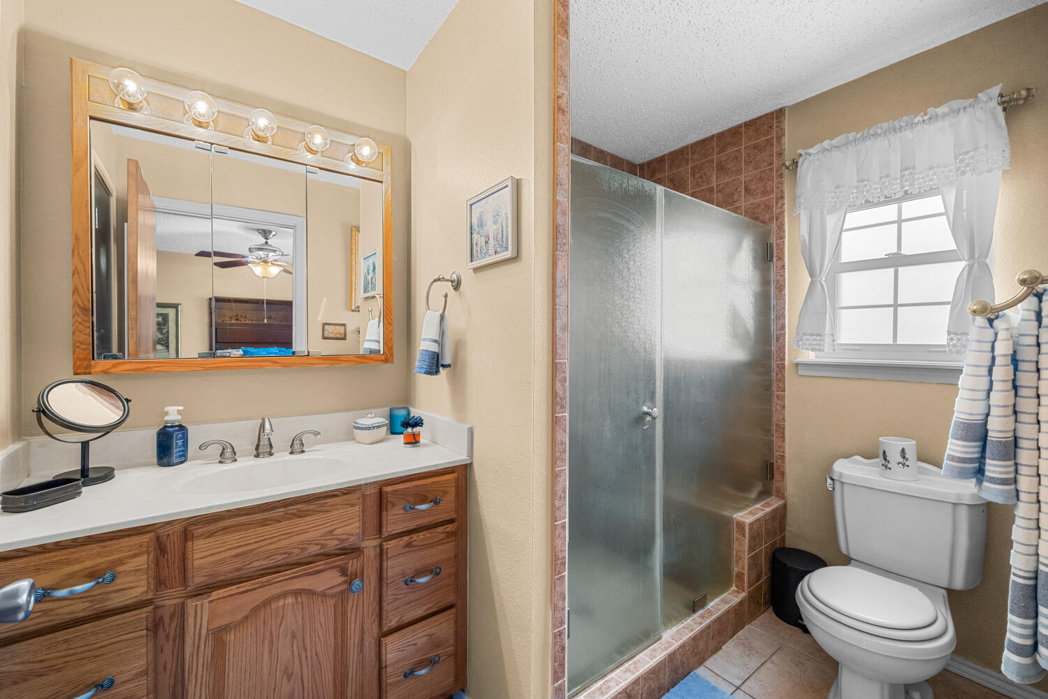 1500 West Lynn Street Slaton, TX 79364 - Photo 18 of 37 a bathroom with a sink toilet and shower
