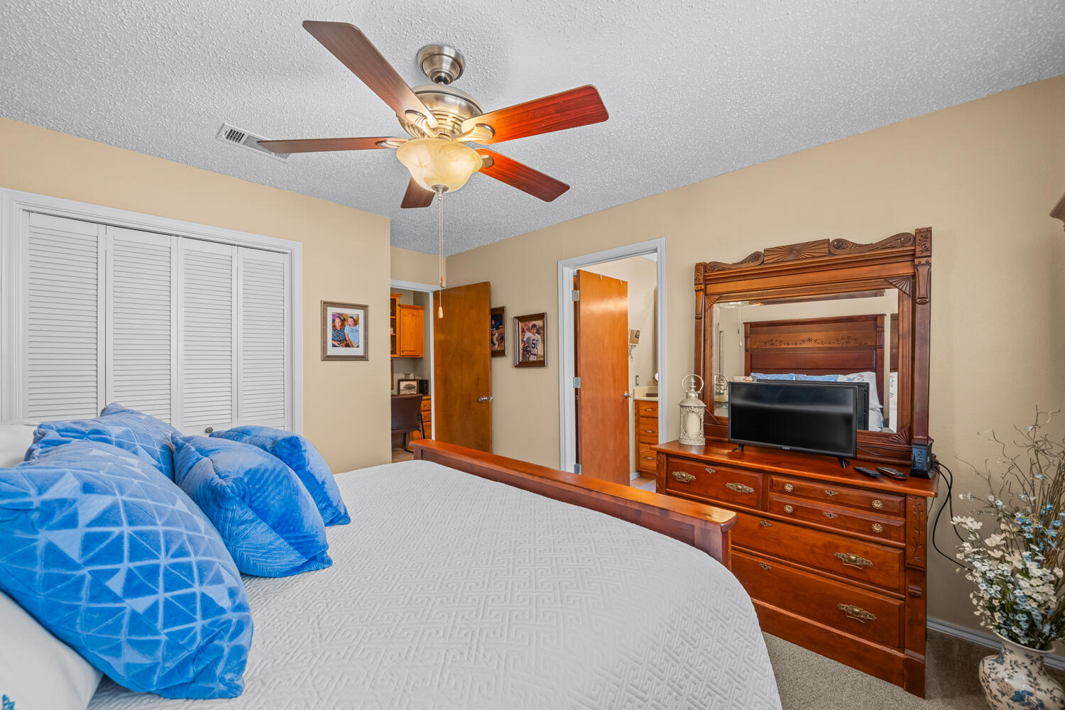 1500 West Lynn Street Slaton, TX 79364 - Photo 24 of 37 a bedroom with a bed and a flat screen tv