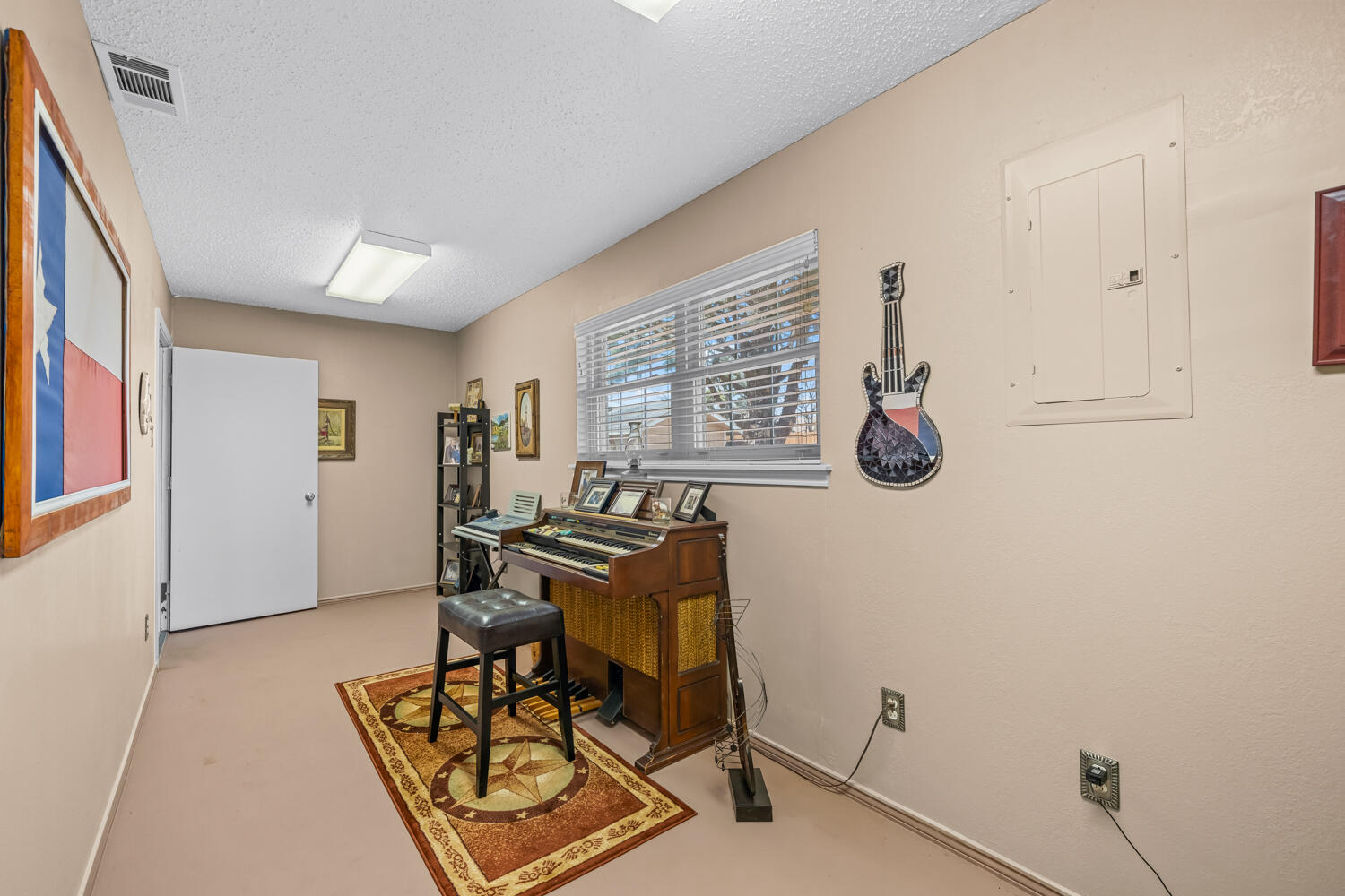 1500 West Lynn Street Slaton, TX 79364 - Photo 28 of 37 a view of a workspace with furniture and a window