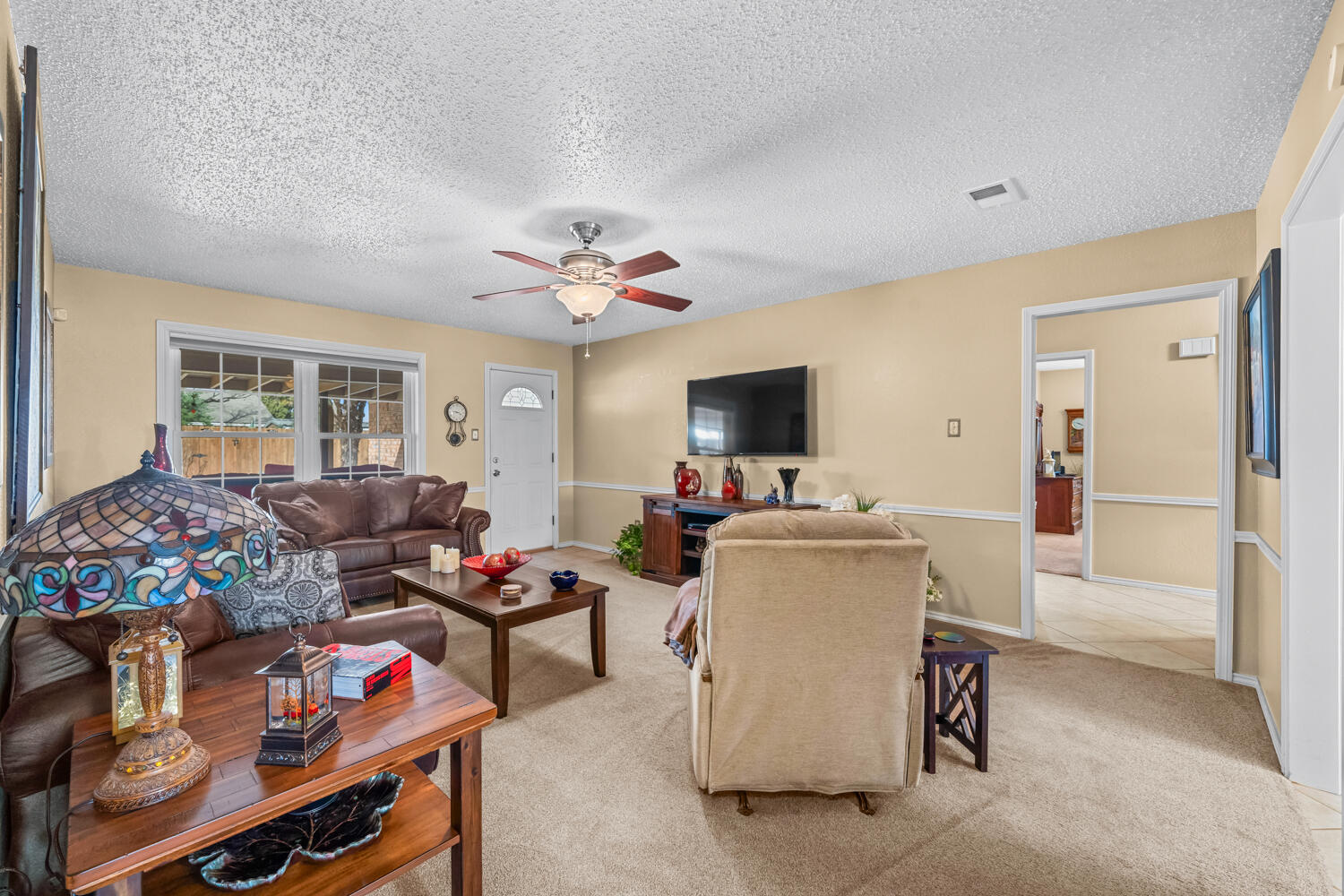 1500 West Lynn Street Slaton, TX 79364 - Photo 4 of 37 a living room with furniture and a flat screen tv