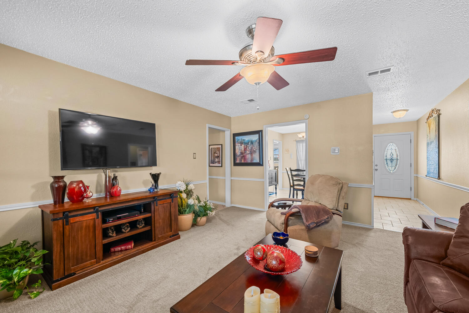1500 West Lynn Street Slaton, TX 79364 - Photo 6 of 37 a living room with furniture and a flat screen tv