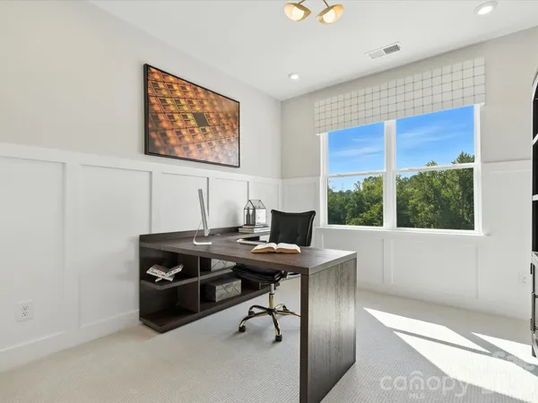 a view of a workspace with furniture