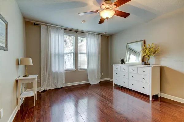a view of a room with wooden floor and cabinet