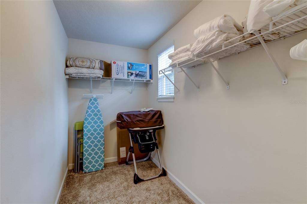 2123 West Spruce Street Tampa, FL 33607 - Photo 23 of 40 a room with cabinets and wooden floor