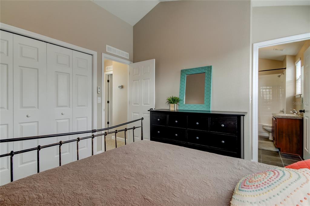 2123 West Spruce Street Tampa, FL 33607 - Photo 26 of 40 a bedroom with a bed and a dresser