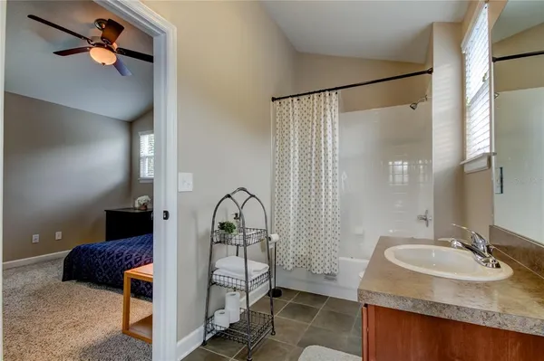 a bathroom with a sink and mirror