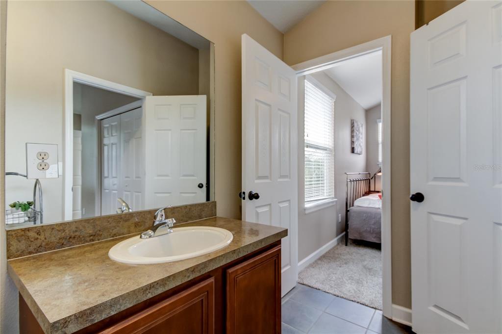 2123 West Spruce Street Tampa, FL 33607 - Photo 30 of 40 a bathroom with a sink double vanity granite and a mirror