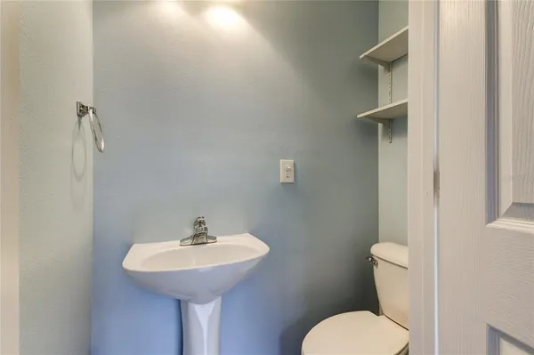 an empty room with a ceiling fan and window