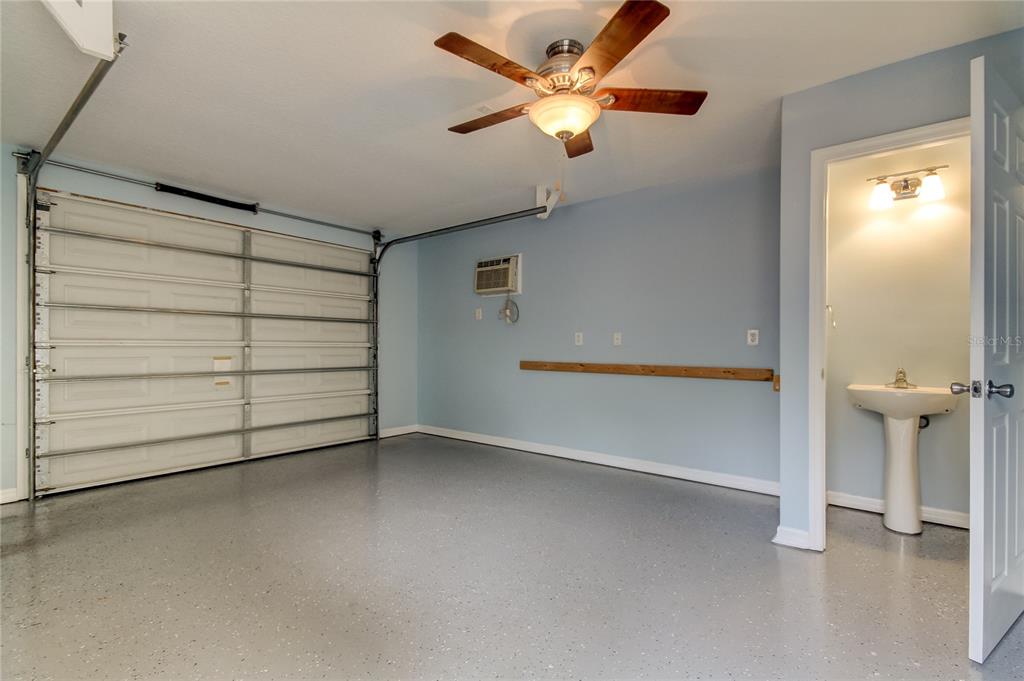 2123 West Spruce Street Tampa, FL 33607 - Photo 40 of 40 an empty room with a ceiling fan and window
