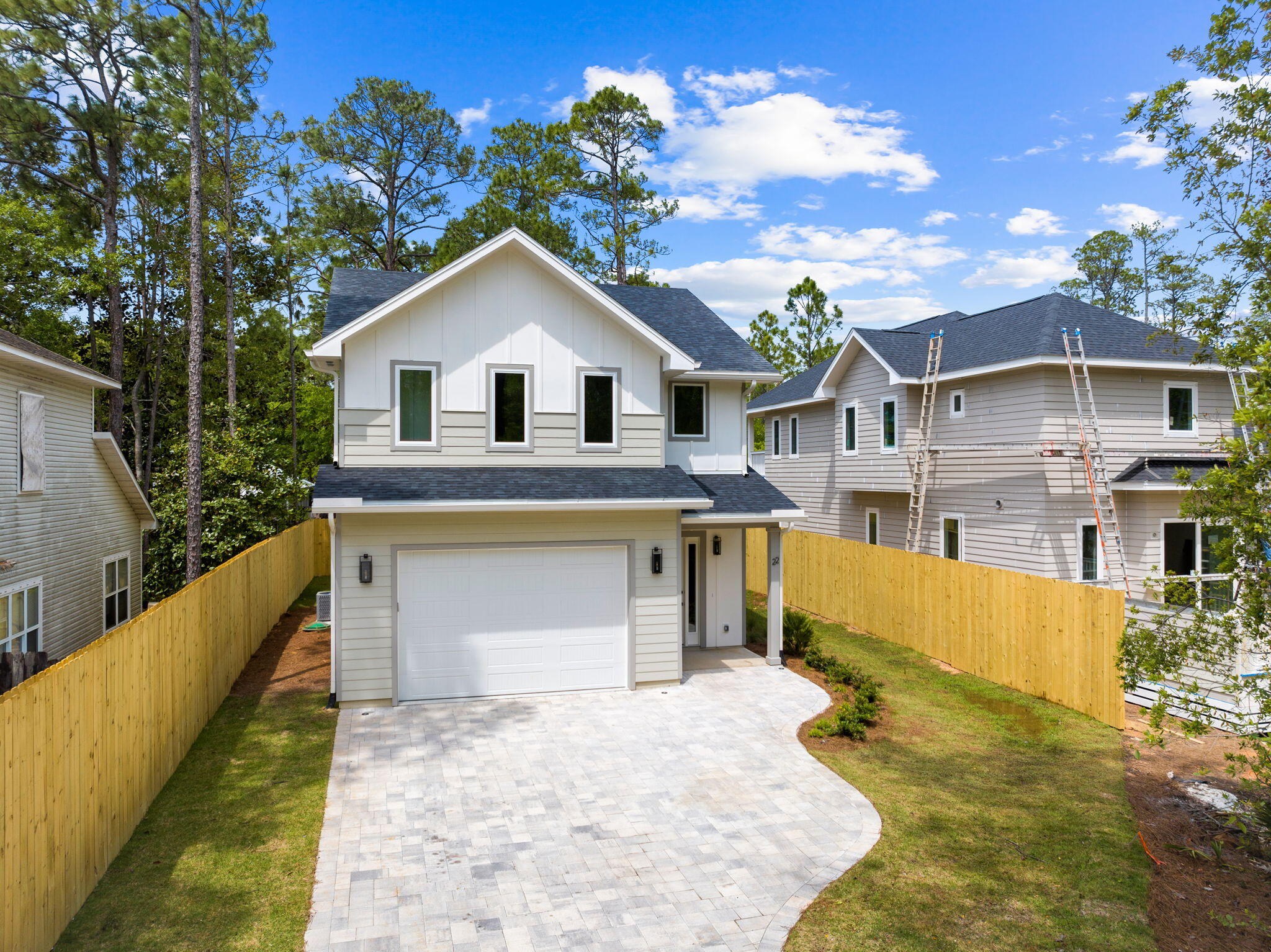 22 Georgie Street Point Washington, FL 32459 - Photo 10 of 57 a front view of a house with a yard and garage